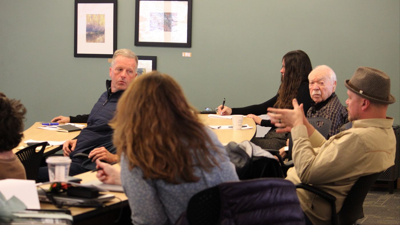 Students and Tahoe community members in discussion around a seminar table