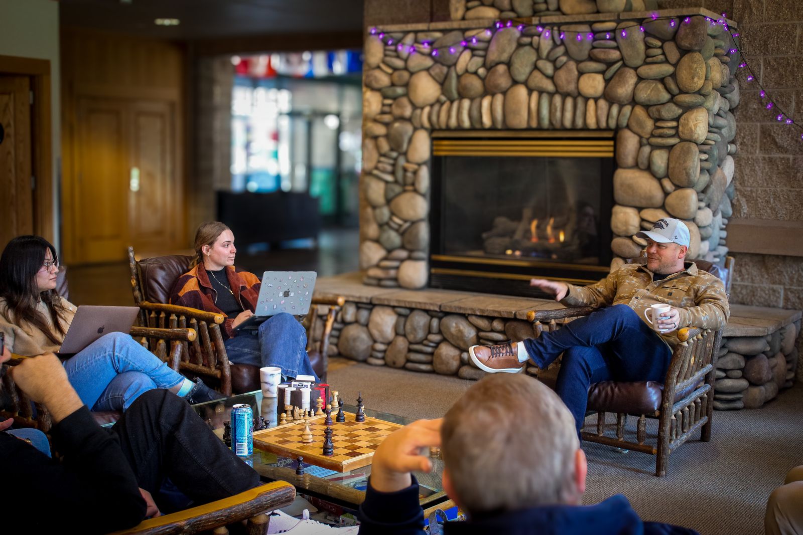 Students and guests in a fireside discussion in Patterson Hall